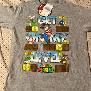 Super Mario Longsleeve shirt. Boys . Multiple colors . Never worn .